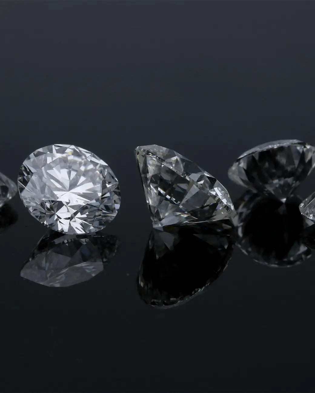 Diamonds on a dark reflective surface