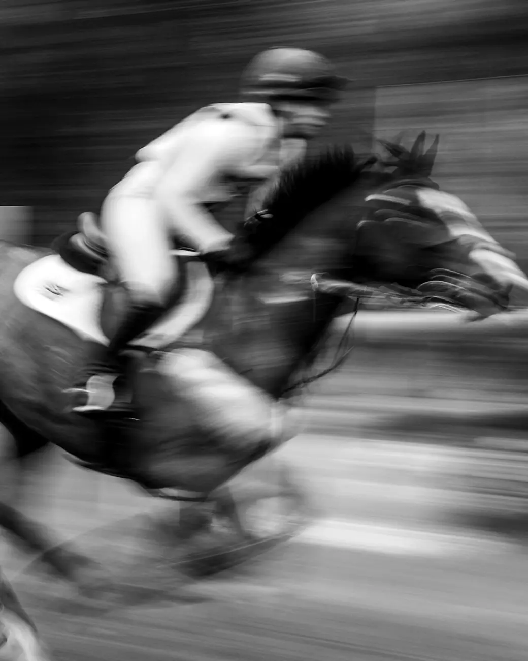 A jockey and horse at full gallop