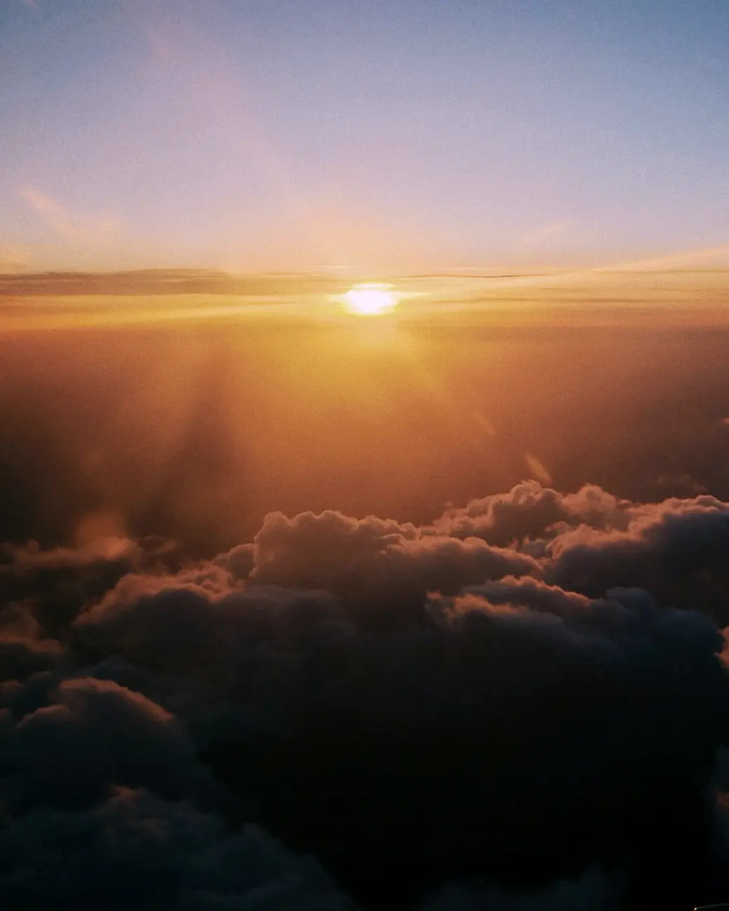 Sunset above the clouds